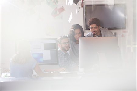 Creative business people using computer in office Stock Photo - Premium Royalty-Free, Code: 6124-08170797