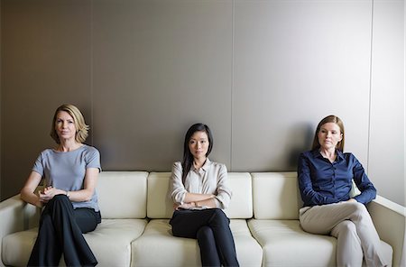 serious woman copy space office - Portrait serious businesswomen waiting on sofa Stock Photo - Premium Royalty-Free, Code: 6124-08520397