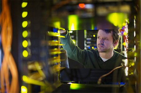 servers and technology - Server room technician working on server panel Stock Photo - Premium Royalty-Free, Code: 6124-08658159