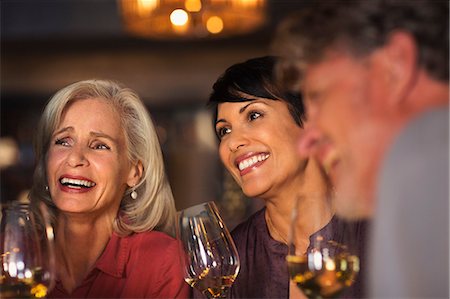 simsearch:6124-08743181,k - Smiling women drinking white wine at bar Stock Photo - Premium Royalty-Free, Code: 6124-08743224