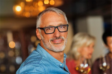 stubble - Portrait confident man with eyeglasses at bar Stock Photo - Premium Royalty-Free, Code: 6124-08743226
