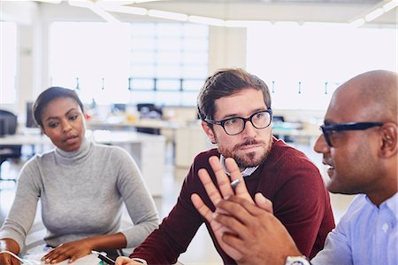 diverse group of business people - Business people talking in meeting Stock Photo - Premium Royalty-Free, Code: 6124-08768350