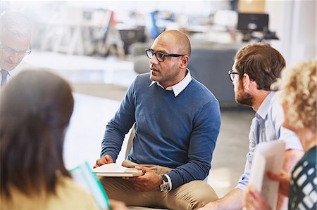 Business people talking in meeting Stock Photo - Premium Royalty-Free, Code: 6124-08768407