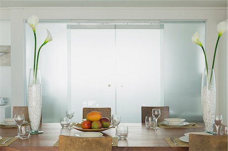 simsearch:6124-08907887,k - Modern dining room with lily vases in home showcase interior Stock Photo - Premium Royalty-Free, Code: 6124-08703859