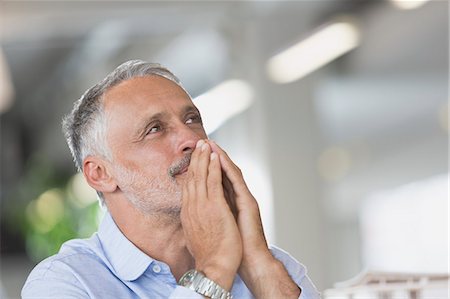 simsearch:6124-08520395,k - Pensive businessman looking away Stock Photo - Premium Royalty-Free, Code: 6124-08703890