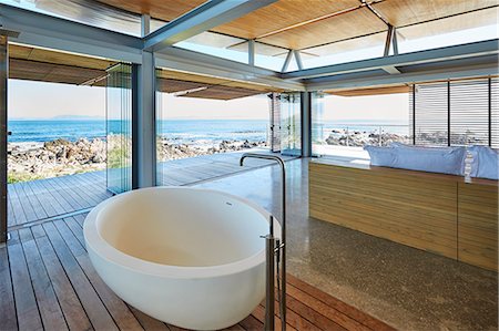 simsearch:6124-08703991,k - Modern luxury home showcase bathroom and sink with ocean view Stock Photo - Premium Royalty-Free, Code: 6124-08704046