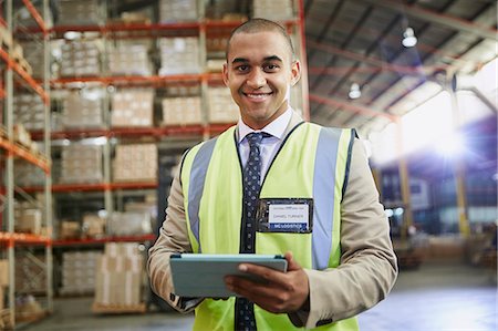 simsearch:6124-08820975,k - Portrait confident manager with digital tablet in distribution warehouse Stock Photo - Premium Royalty-Free, Code: 6124-08820977