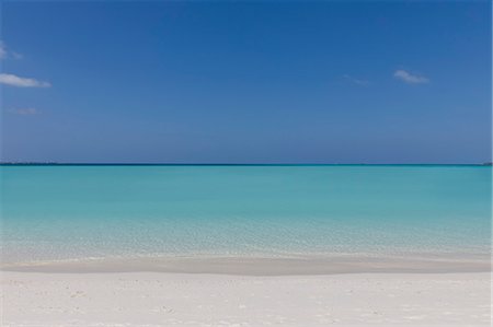 simsearch:6113-07160363,k - Seascape view blue tropical ocean under sunny blue sky Stock Photo - Premium Royalty-Free, Code: 6124-08945939