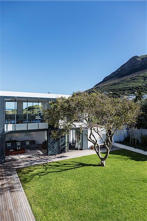 simsearch:6124-08908189,k - Sunny luxury home showcase exterior and yard below mountain Stock Photo - Premium Royalty-Free, Code: 6124-08907880