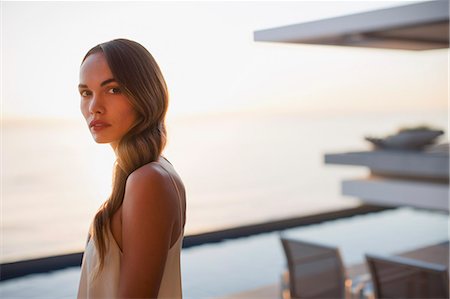 swim pool - Portrait serious, beautiful woman on luxury patio Stock Photo - Premium Royalty-Free, Code: 6124-09099777