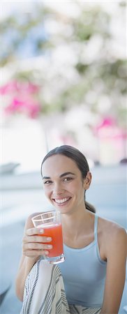 person drinking smoothie - Portrait smiling, confident brunette woman drinking juice Stock Photo - Premium Royalty-Free, Code: 6124-09099798
