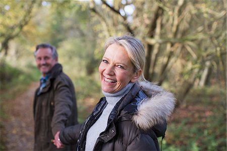 retirement outdoors - Portrait smiling, happy mature couple holding hands in park Stock Photo - Premium Royalty-Free, Code: 6124-09167257