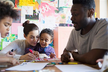 Family coloring at table Stock Photo - Premium Royalty-Free, Code: 6124-09167327