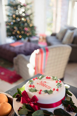 food on a sideboard - Decorated noel Christmas cake on sideboard in living room Stock Photo - Premium Royalty-Free, Code: 6124-09178010