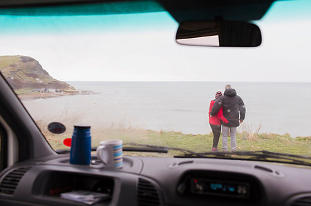 simsearch:649-06433680,k - Affectionate couple enjoying ocean view outside motor home Photographie de stock - Premium Libres de Droits, Code: 6124-09188812