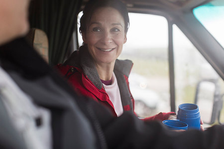 simsearch:6124-09269499,k - Smiling woman drinking coffee in motor home Stock Photo - Premium Royalty-Free, Code: 6124-09188821