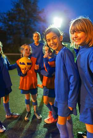 football player talking to girl - Portrait smiling, confident girls soccer team Stock Photo - Premium Royalty-Free, Code: 6124-09197436