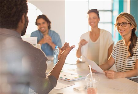 Smiling creative business people brainstorming in conference room meeting Foto de stock - Sin royalties Premium, Código: 6124-09130985