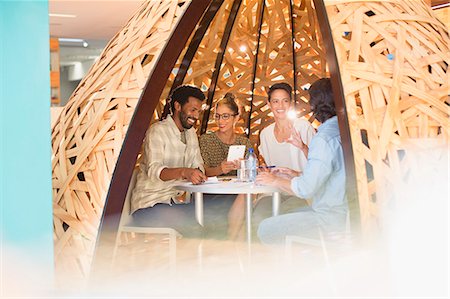 simsearch:632-08886441,k - Creative business people meeting in creative workspace teepee Stock Photo - Premium Royalty-Free, Code: 6124-09131086