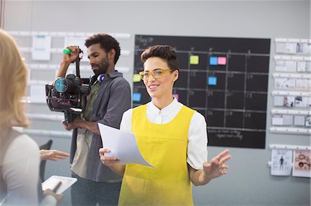 pictures of male camera man - Female vlogger and cameraman preparing in office Stock Photo - Premium Royalty-Free, Code: 6124-09131094