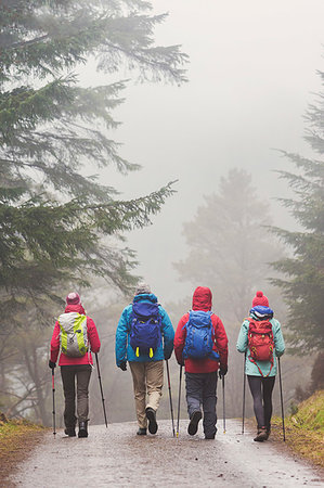 dad daughter rain - Family hiking in woods Stock Photo - Premium Royalty-Free, Code: 6124-09269690