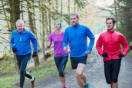 simsearch:649-07239718,k - Family jogging in woods Stock Photo - Premium Royalty-Free, Code: 6124-09269754