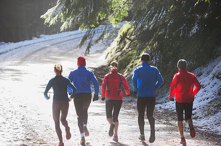 senior exercising winter - Family jogging in winter woods Stock Photo - Premium Royalty-Free, Code: 6124-09269710