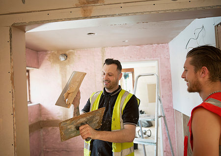 skill development - Construction workers plastering in house Stock Photo - Premium Royalty-Free, Code: 6124-09229060