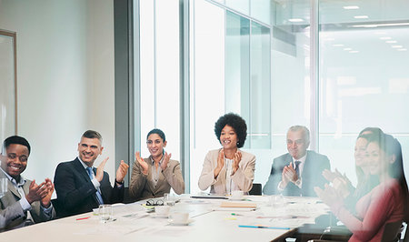 simsearch:614-03506986,k - Happy, supportive business people clapping in conference room meeting Fotografie stock - Premium Royalty-Free, Codice: 6124-09229233