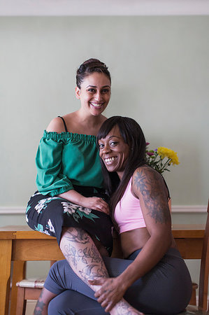 Portrait confident, affectionate lesbian couple with tattoos Stock Photo - Premium Royalty-Free, Code: 6124-09239260