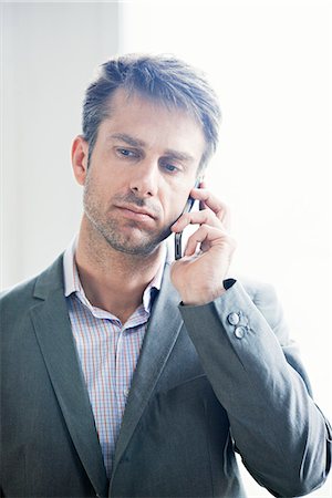 simsearch:649-09205540,k - Mature businessman using mobile phone Stock Photo - Premium Royalty-Free, Code: 6126-08580719