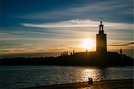 stockholm city hall - Sweden, Uppland, Stockholm, Sunset over Stadshuset Stock Photo - Premium Royalty-Free, Code: 6126-08642943