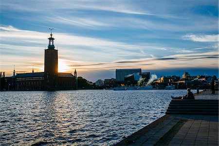 stockholm city hall - Sweden, Uppland, Stockholm, Sunset over Stadshuset Stock Photo - Premium Royalty-Free, Code: 6126-08642945