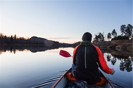 Sweden, Medelpad, Nolby, Man canoeing at dawn Photographie de stock - Premium Libres de Droits, Code: 6126-08642962