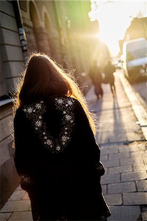 straight hair - Sweden, Stockholm, Sodermalm, Rear view of walking woman Stock Photo - Premium Royalty-Free, Code: 6126-08643255