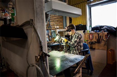 simsearch:6126-08644046,k - Sweden, Young man welding metal Stock Photo - Premium Royalty-Free, Code: 6126-08643222