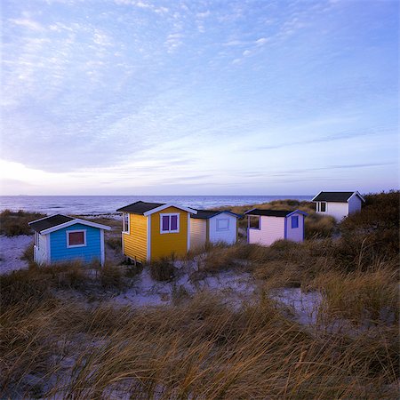 simsearch:6126-08643402,k - Sweden, Skane, Skanor Falsterbo, Beach huts in autumn evening Stock Photo - Premium Royalty-Free, Code: 6126-08643403