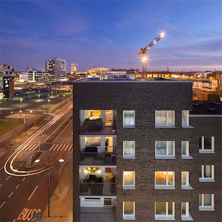 person in crane - Sweden, Skane, Malmo, Vastra Hamnen, City at night Stock Photo - Premium Royalty-Free, Code: 6126-08643546