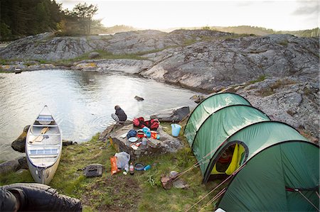 Sweden, West Coast, Bohuslan, Flato, Tent on rocky riverbank Stock Photo - Premium Royalty-Free, Code: 6126-08643875