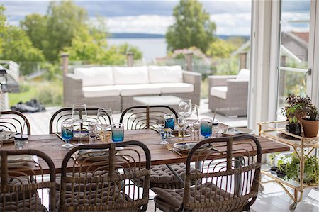 simsearch:6126-08644248,k - Sweden, Halland, Onsala, Dining room with terrace Photographie de stock - Premium Libres de Droits, Code: 6126-08643879