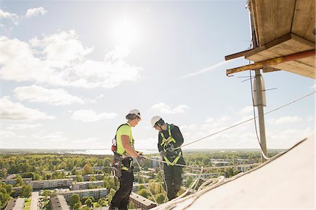 simsearch:6126-09104272,k - Sweden, Narke, Orebro, Construction workers on roof Stock Photo - Premium Royalty-Free, Code: 6126-08643976