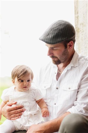 simsearch:6126-08636742,k - Sweden, Varmland, Filipstad, Gasborn, Horrsjon, Portrait of man with baby girl (12-17 months) Stock Photo - Premium Royalty-Free, Code: 6126-08643985