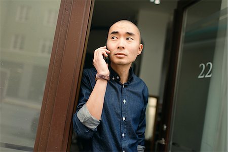 Sweden, Young man on the phone Stock Photo - Premium Royalty-Free, Code: 6126-08644044
