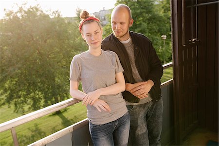 simsearch:6126-08644046,k - Sweden, Vasterbotten, Norrmjole, Young couple standing on balcony Stock Photo - Premium Royalty-Free, Code: 6126-08644060