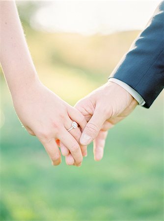 pictures at a wedding - Sweden, Close-up of holding hands of newlyweds Stock Photo - Premium Royalty-Free, Code: 6126-08644295