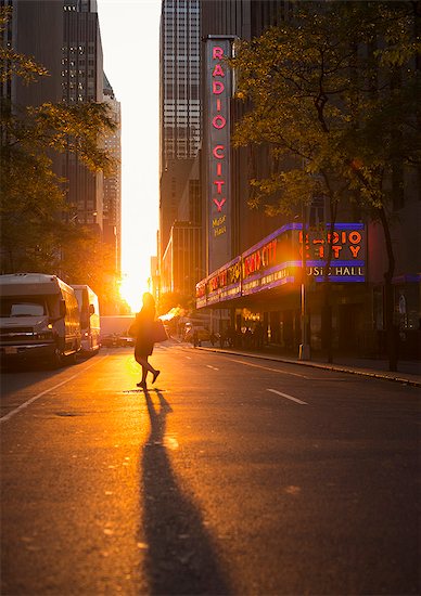 USA, New York, Street with pedestrians at sunset Stock Photo - Premium Royalty-Free, Image code: 6126-08644350