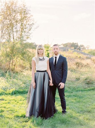 female mature blondes - Sweden, Groom and bride standing together holding hands Stock Photo - Premium Royalty-Free, Code: 6126-08644302