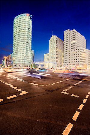 simsearch:6126-08644569,k - Germany, Berlin, Potsdamer Platz, Road intersection and illuminated skyscrapers at night Stock Photo - Premium Royalty-Free, Code: 6126-08644557