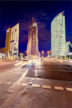 simsearch:6126-08644576,k - Germany, Berlin, Potsdamer Platz, Road intersection and illuminated skyscrapers at night Stock Photo - Premium Royalty-Free, Code: 6126-08644558