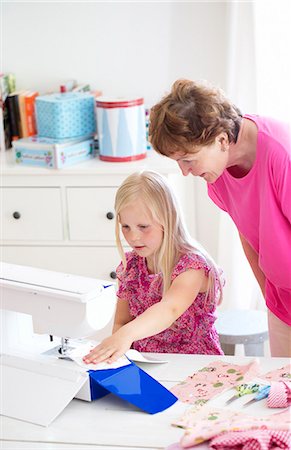 Finland, Grandmother teaching her granddaughter (8-9) sewing Stock Photo - Premium Royalty-Free, Code: 6126-08644755